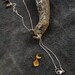 mushroom charm necklace in sterling silver and bronze