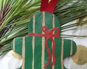 Hand painted gingerbread man Christmas ornament with green stripes and red bow - BetweenThePines