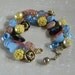Vintage button bracelet glass, metal and plastic buttons in pink, yellow, blue and black hearts and flowers