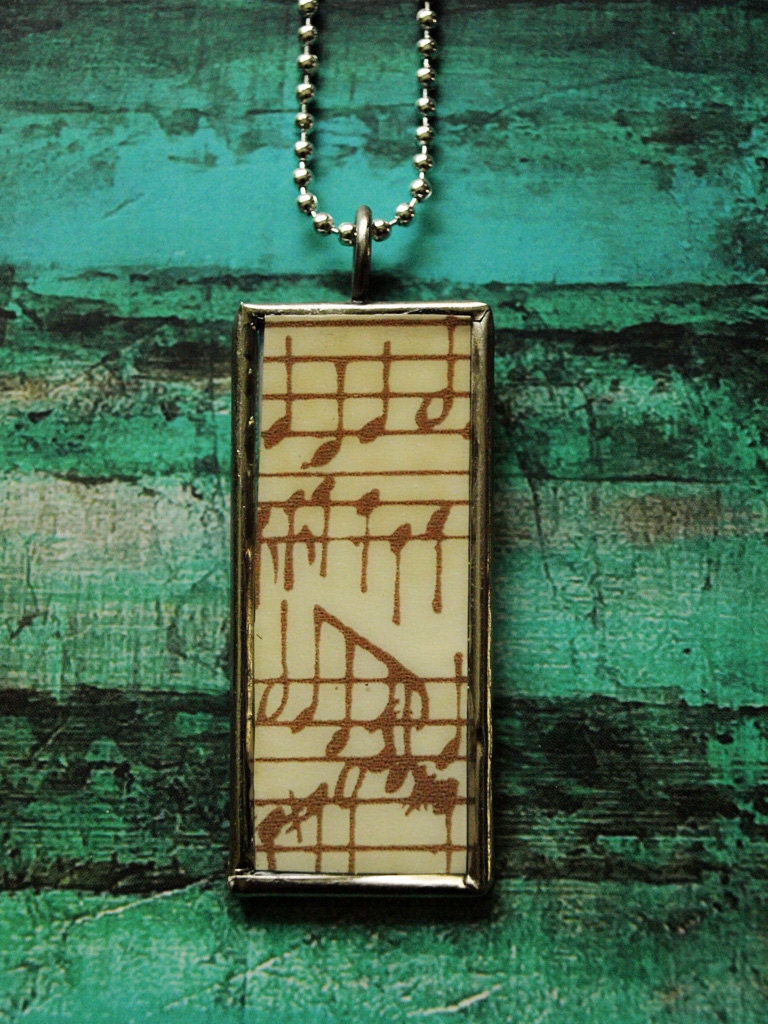 Overlook tree and rock pendant on framed glass- Music on reverse