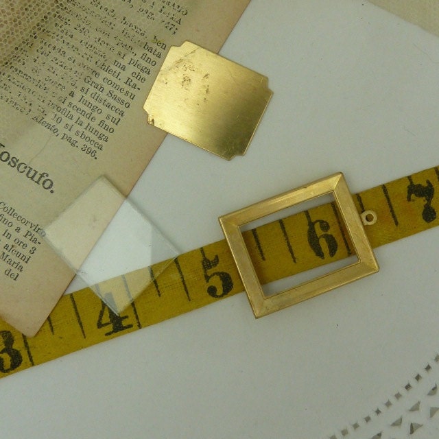 1 - 3 piece solid brass charm  frame  with glass insert and brass back .