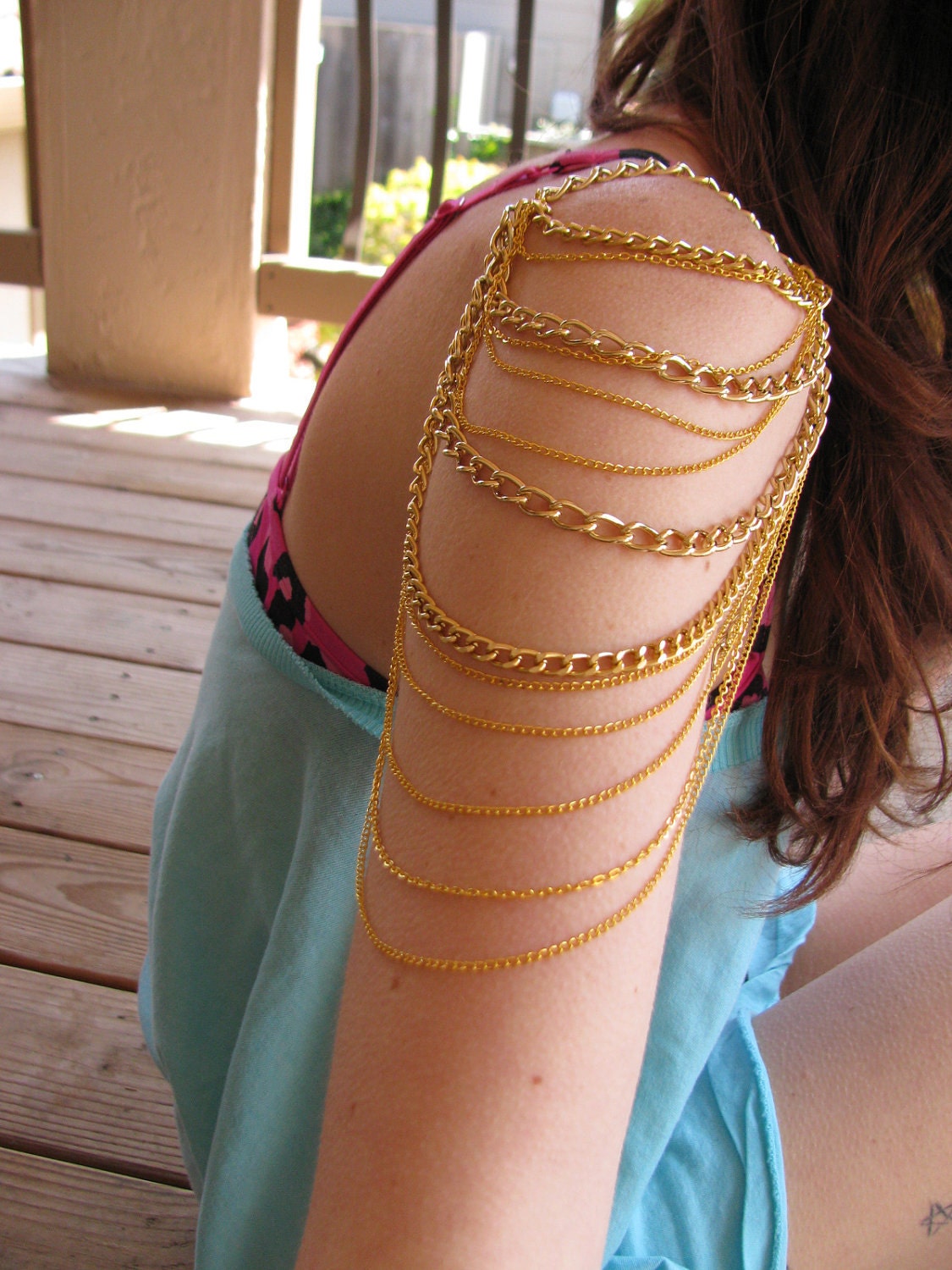 Gold mutli chain arm chain