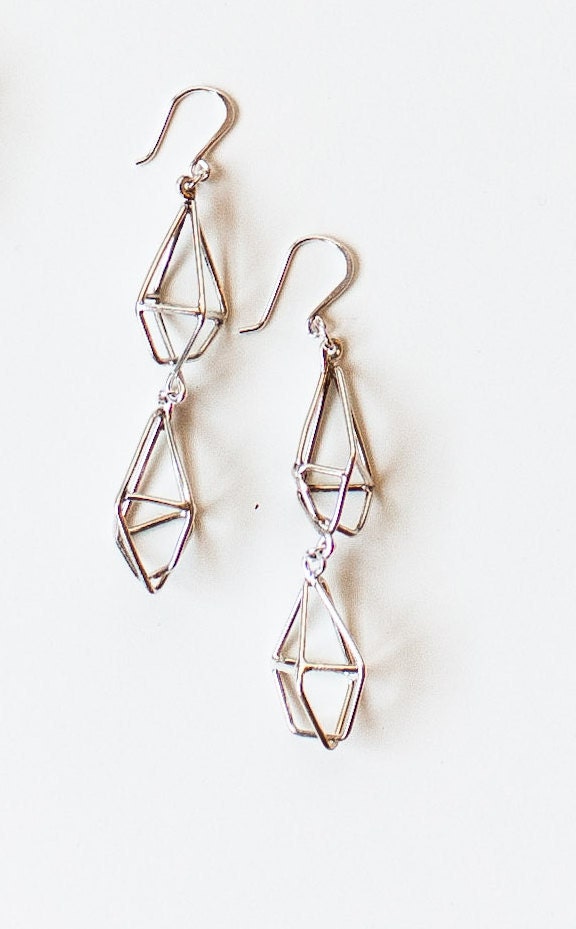 Handmade sterling sliver earrings.  Double diamond handmade shape.  These earrings are large but light and edgy.