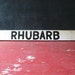 Vintage Wood Road side produce sign. Rhubarb