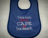 Blue Bib - These Fools Put My Cape on Backwards - Baby Girl or Boy Bib - Blue Bib with Red and White Embroidery