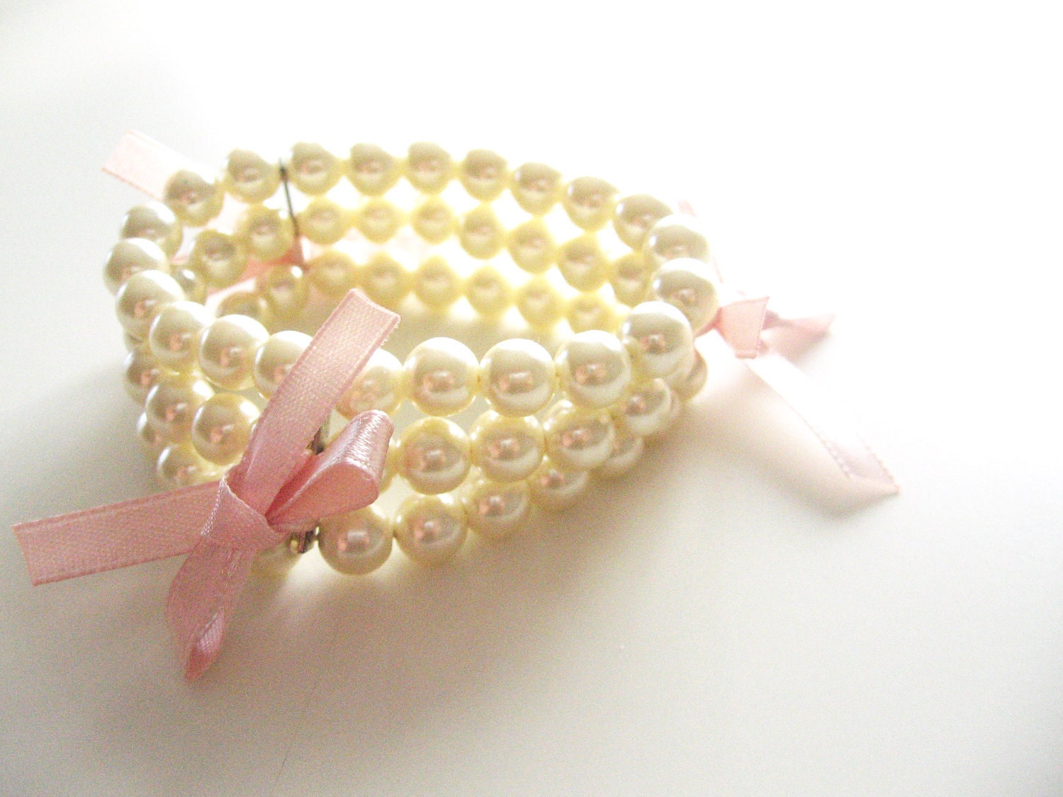 Shabby chic romantic pearl bracelet- three layers of pearls-round pearls pink bows