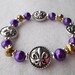 Purple and Gold Metallic Fleur - de - Lis Stretch Bracelet LSU