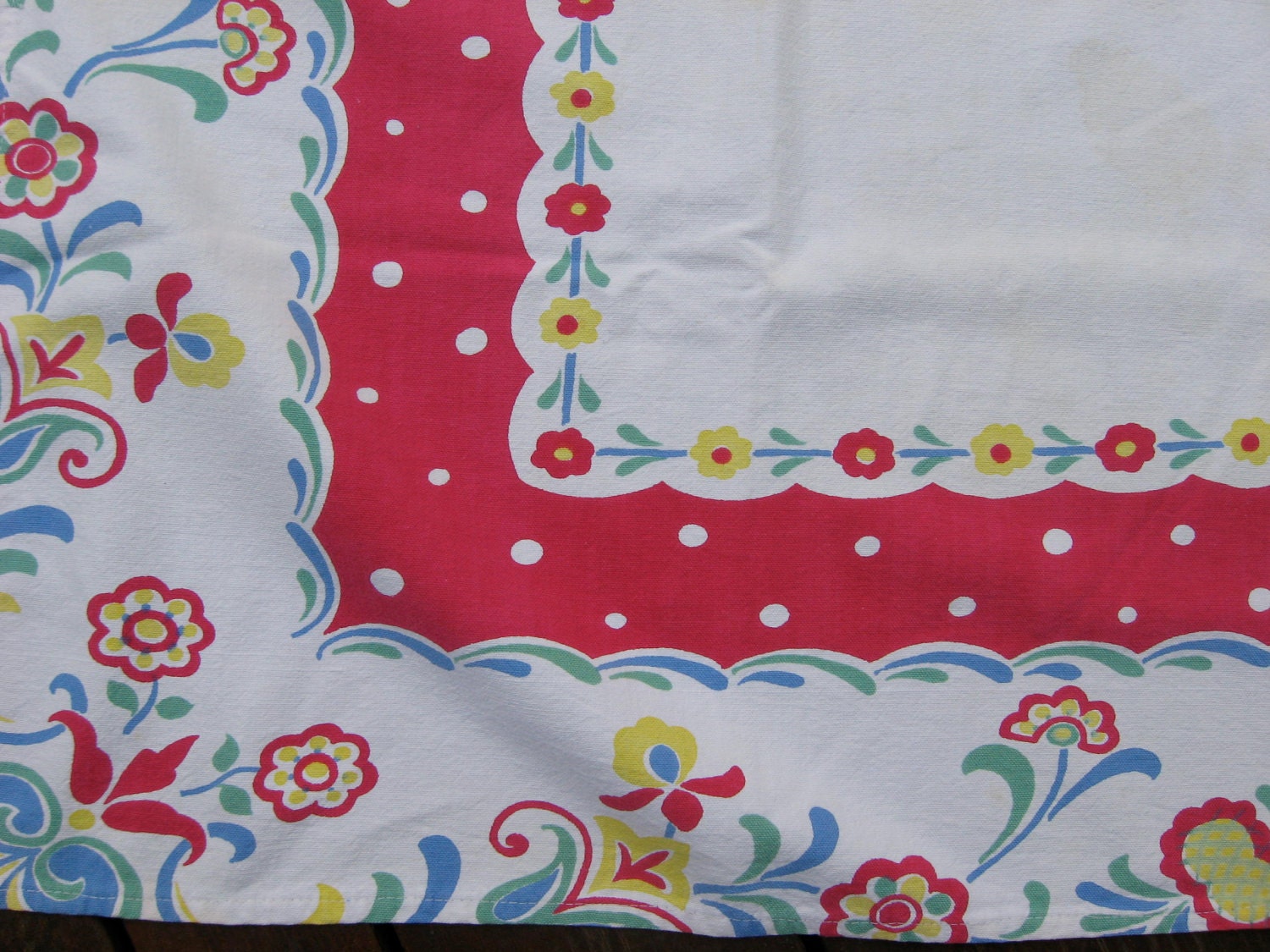 Vintage tablecloth in a fun red floral pattern