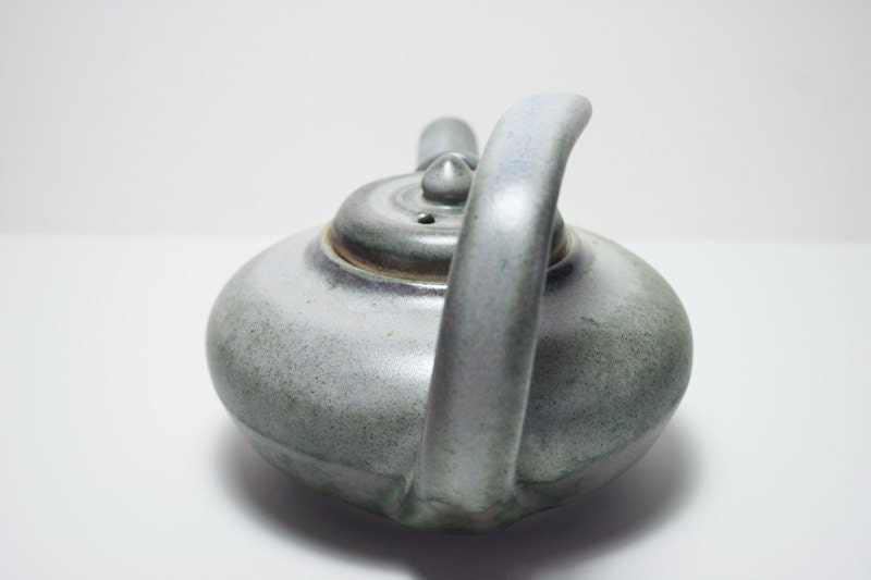 Floating handle teapot in two tone green