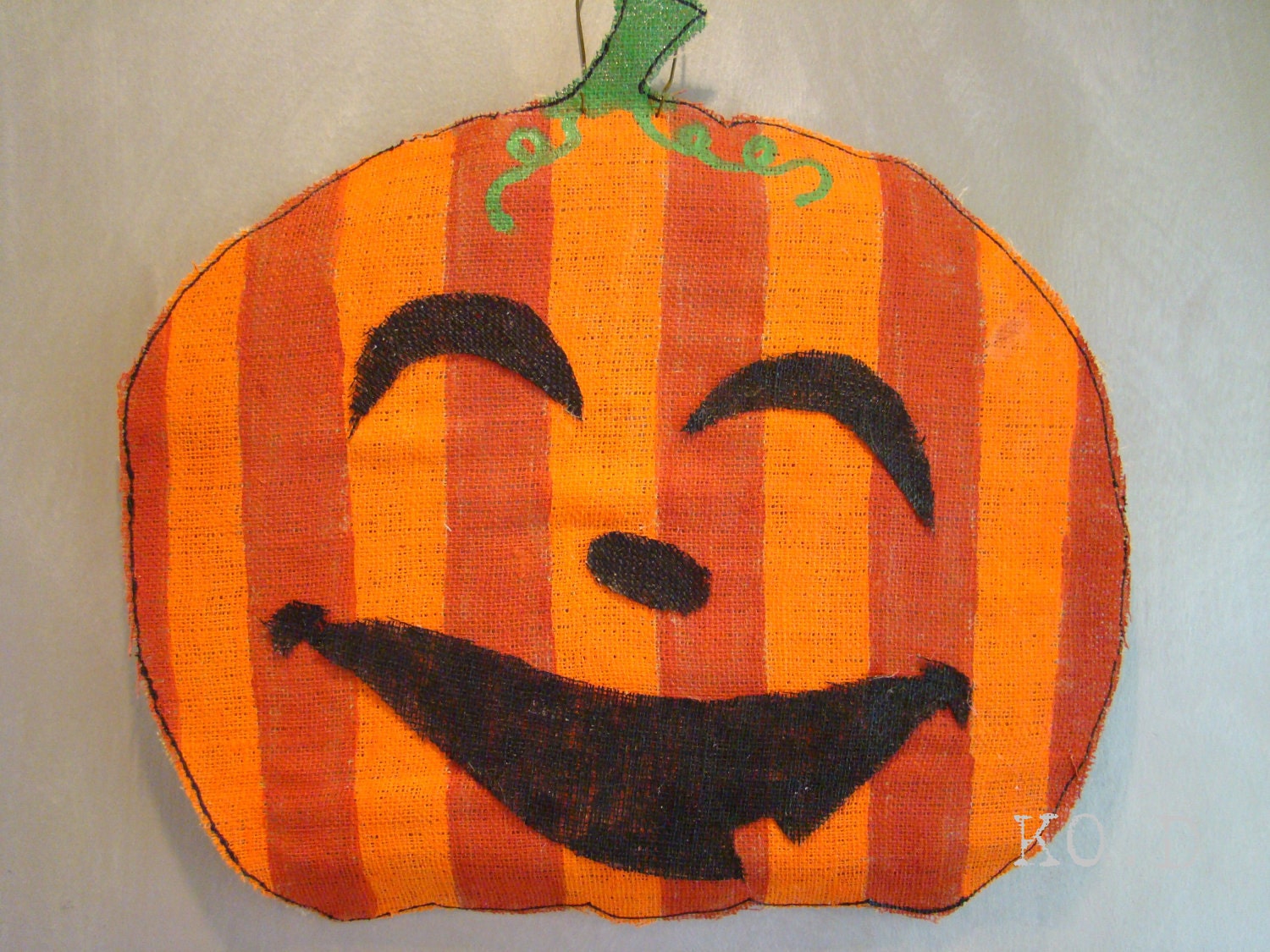 Handpainted striped happy pumpkin face burlap door hanging - 23"w x 22"h