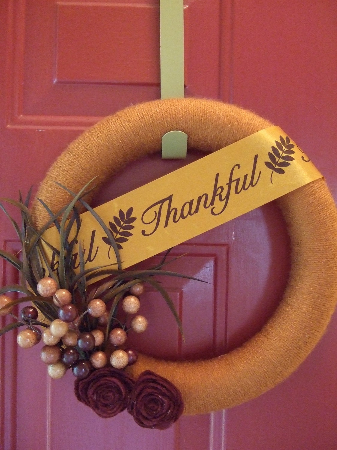 Fall Yarn Wreath with felt flowers berries and feathers