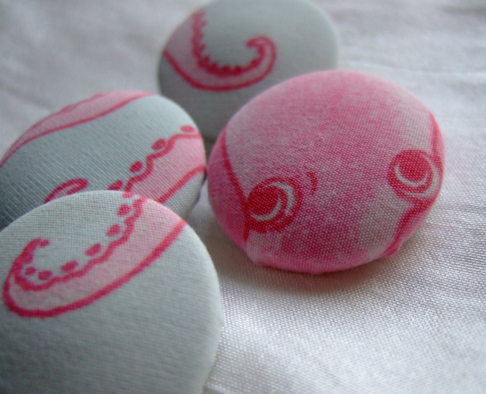 pink octopus buttons, 4 1 1/8 in covered buttons with pink octopus on pale aqua ground