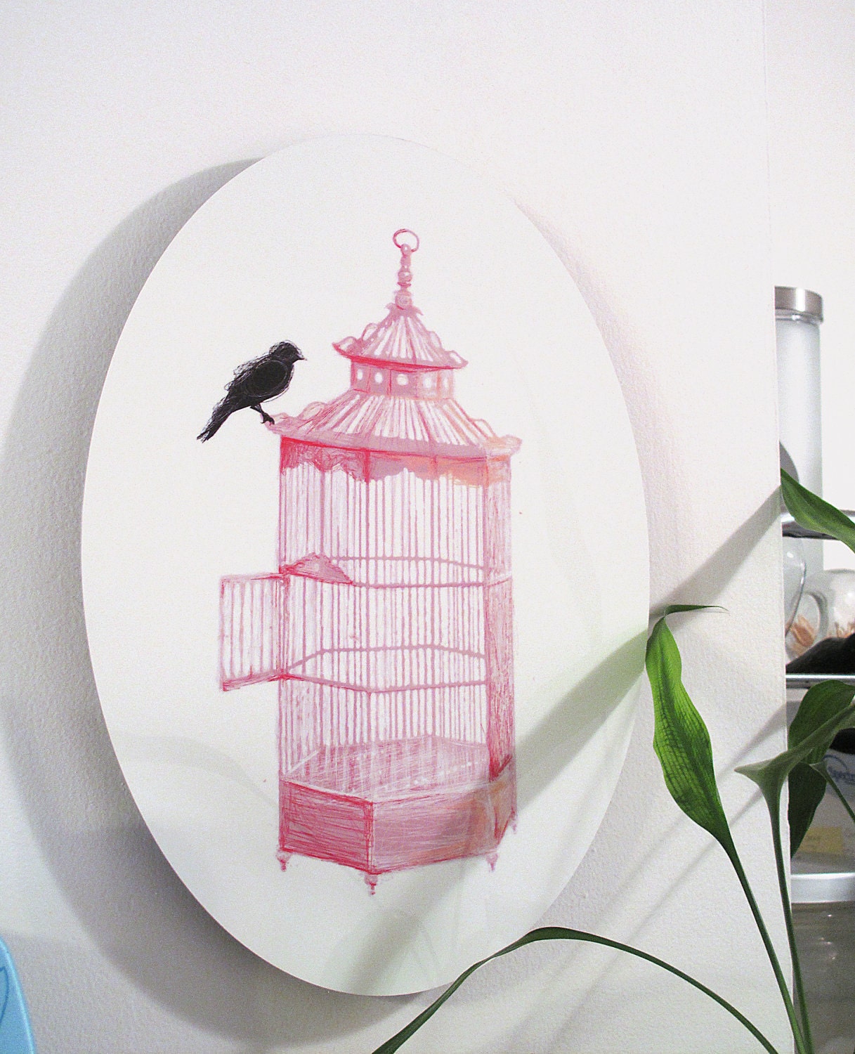 PRETTY smart BIRD-----An Illustration of a black bird perched upon a pink bird cage Infused onto a 14" High Gloss Metal Oval