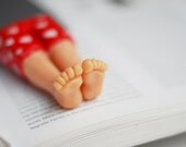 Real macho bookmark. Red pants with white hearts. Legs in the book. st. Valentine for her, him, for gay