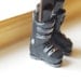 Ski boots bookmark. Legs in the book. Funny grey present for skier, fim, dude, dad. Winter sport