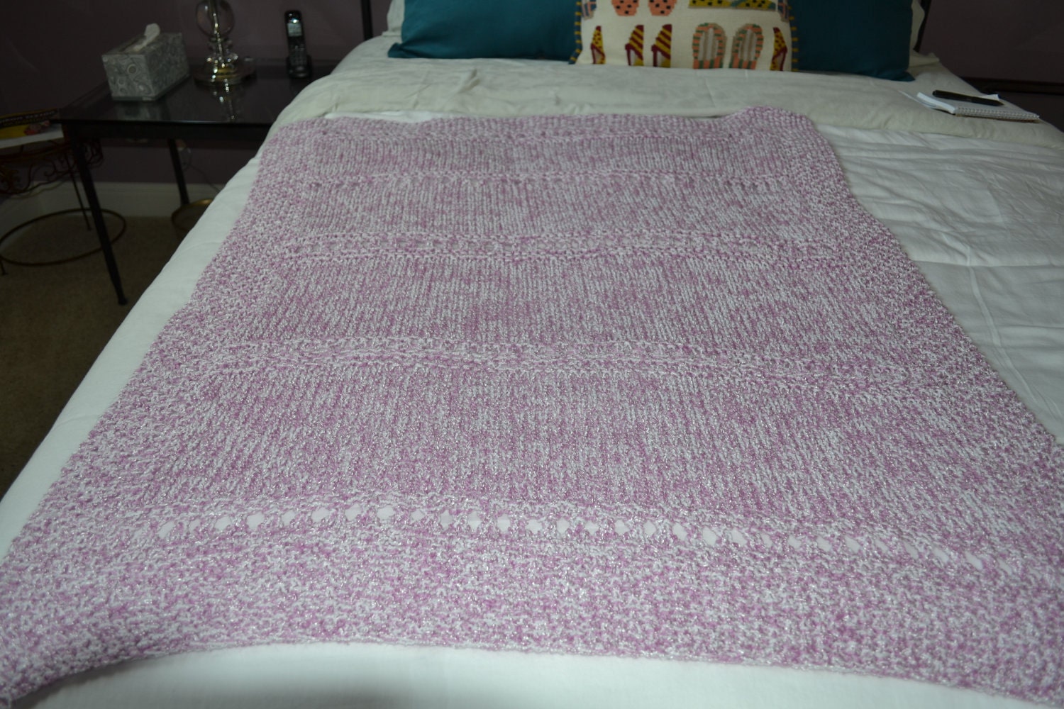Pink and white hand knit baby blanket