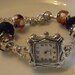 Charm style bracelet watch with beautiful beads