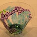 Hand blown clear glass bowl with aqua, violet, and green pattern