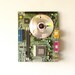Wall clock made from a recycled Computer green circuit board