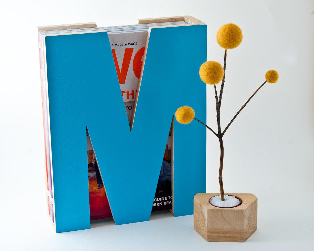 M is for magazine. In turquoise.