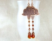 Copper earrings with oriental pattern.