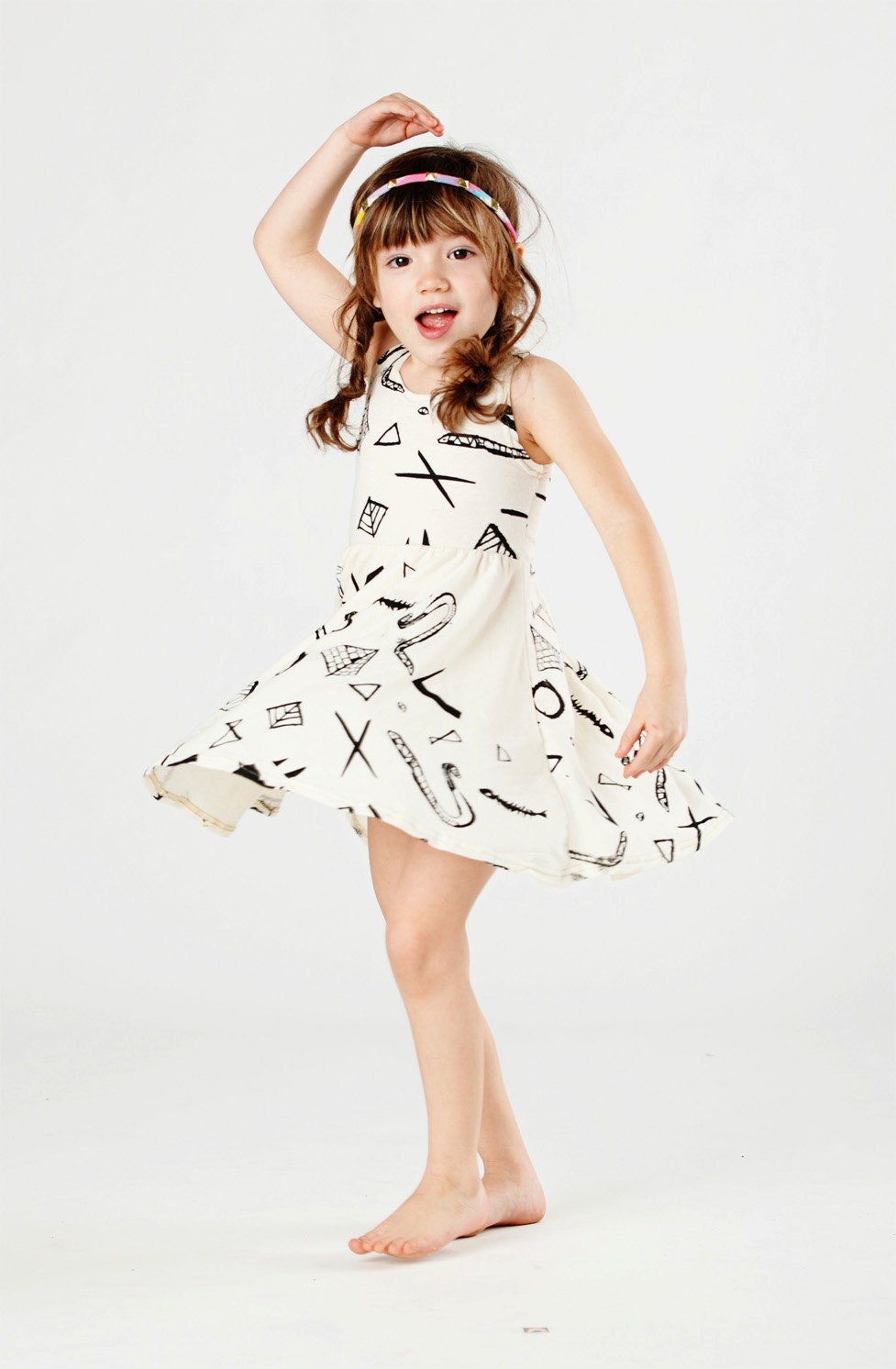 Twirling Dress in Black on Creme Snake Pyramid Print