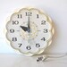 Vintage wall clock, white with scalloped edges and aqua blue second hand