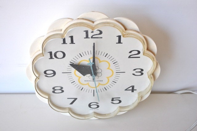 Vintage wall clock, white with scalloped edges and aqua blue second hand