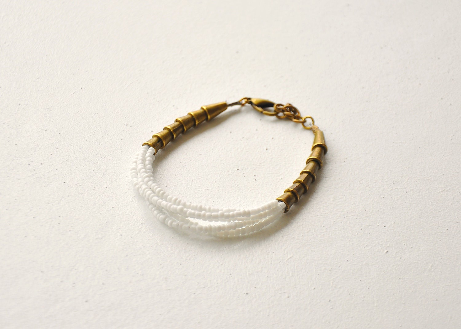 white glass antique brass bead bracelet