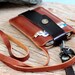Chocolate brown leather iphone wallet with neck strap
