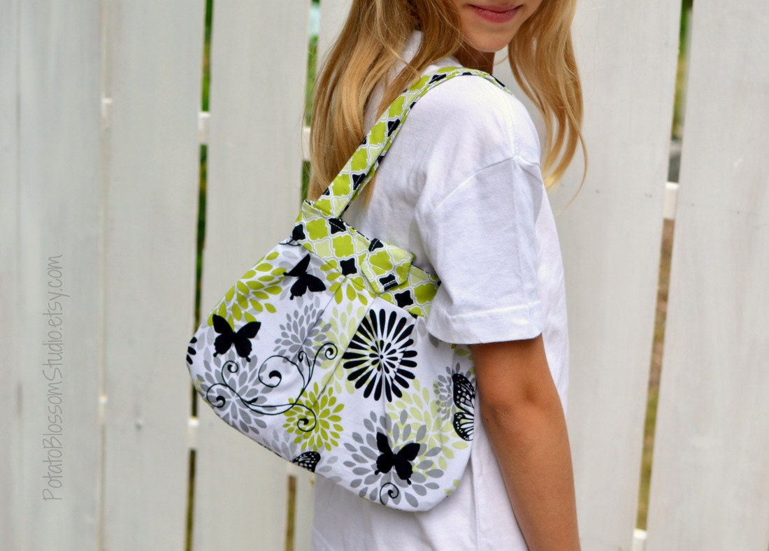 Child's pleated purse in butterfly print of lime green, black, grey and white