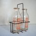 Two Vintage Milk Bottles in Holder