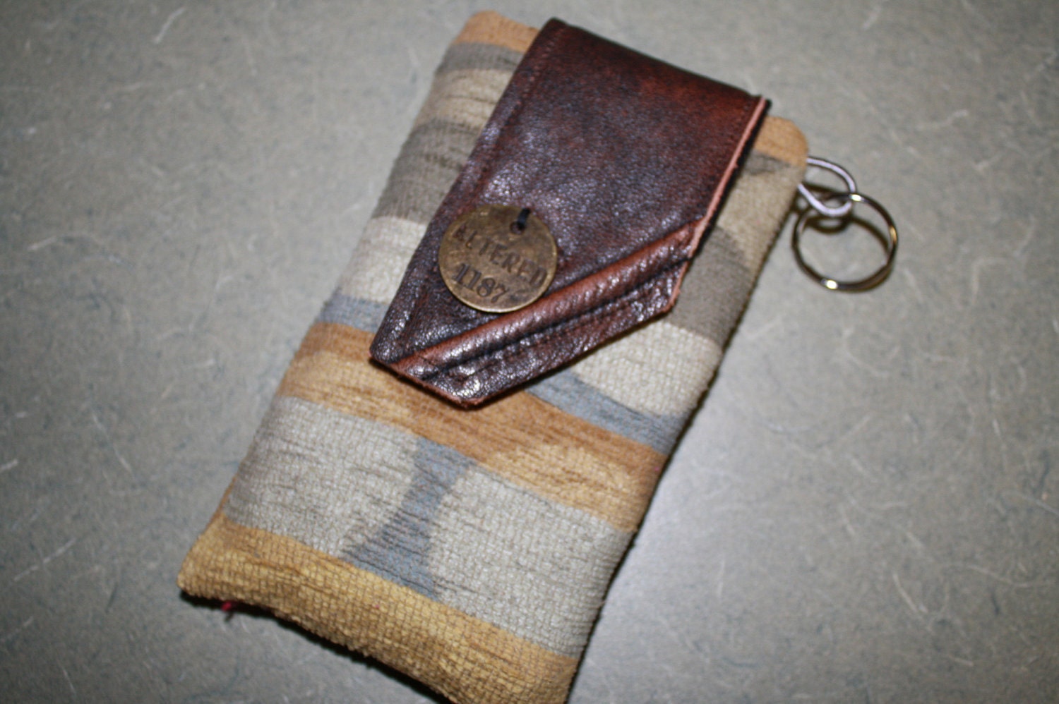 Striped Blue and Gold Cell Phone Case with Leather Closure and Metal Tag