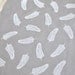 quill in alabaster on grey cotton handprinted fabric panel