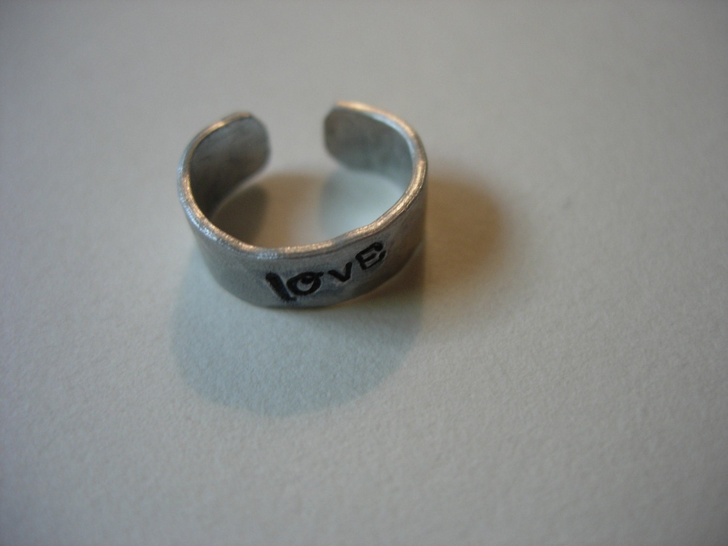 Ear Cuff, Hand Hammered Aluminum with LOVE stamped into the metal and blackened