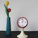 Pedestal retro alarm clock from the seventies vintage