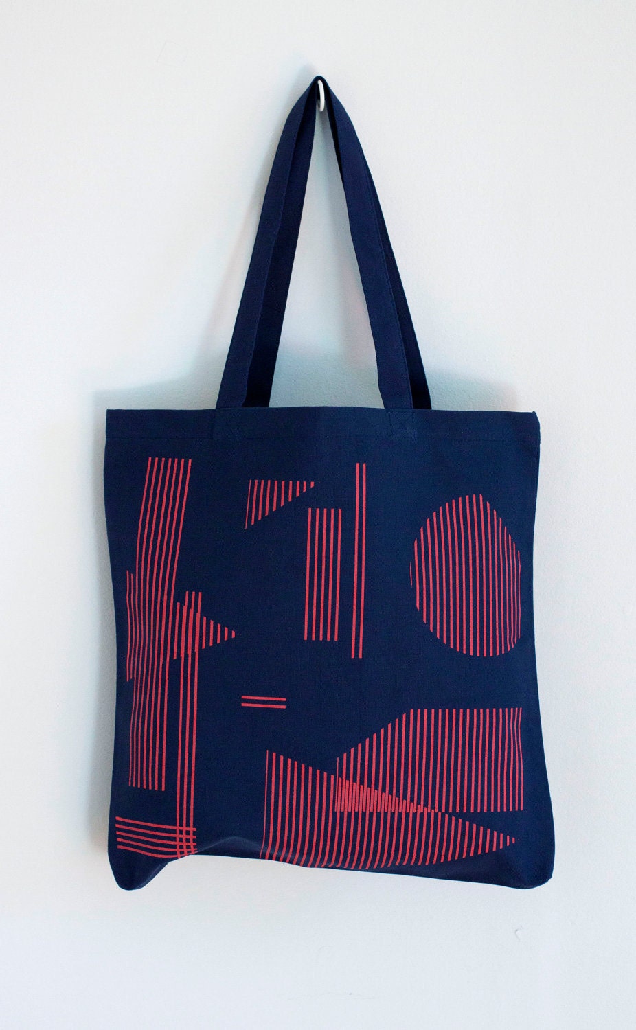 Floating Shapes tote in red on navy blue