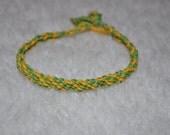 Kumihimo unisex woven bracelet, Knot/loop closure, green, yellow