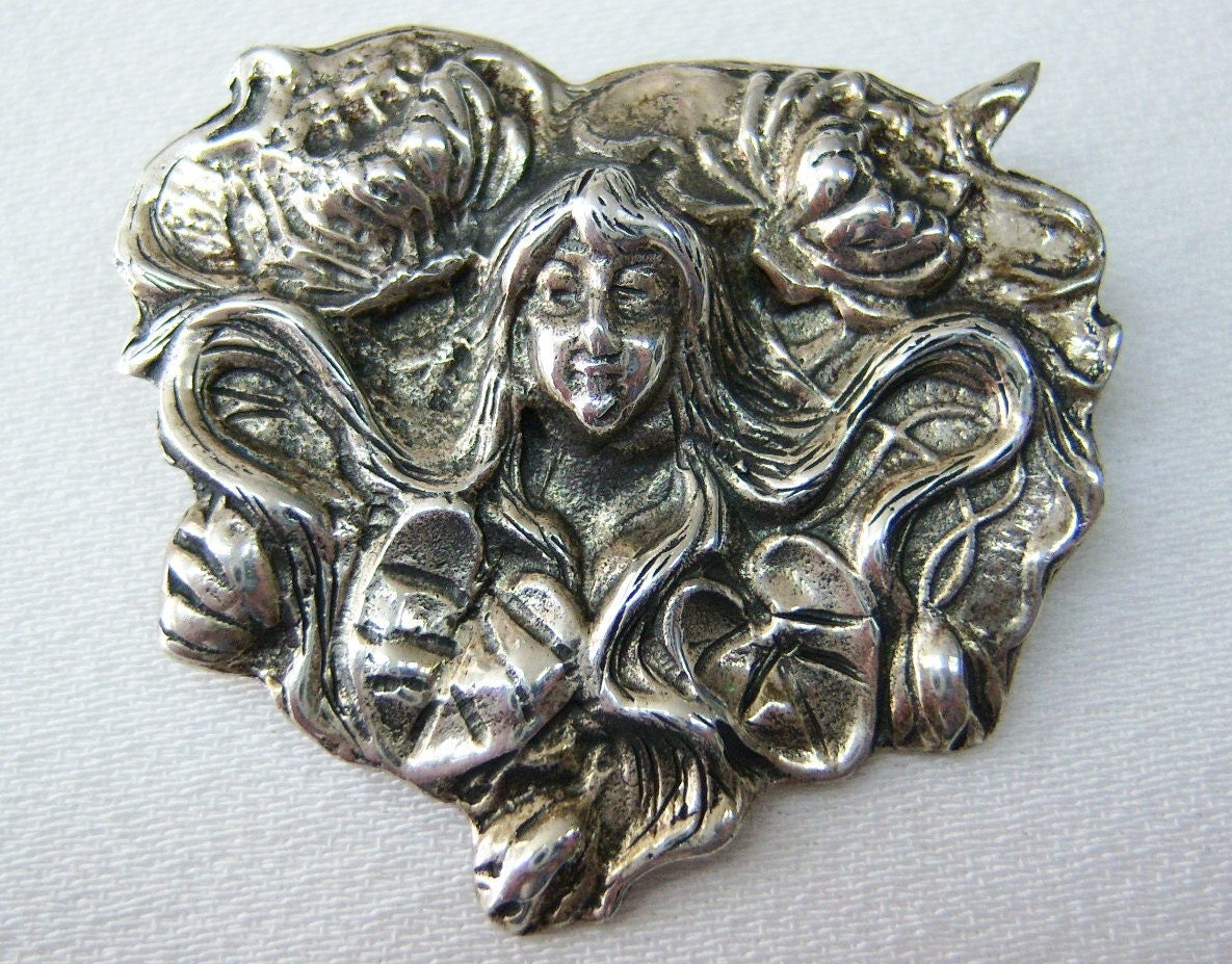 Art Nouveau face & waterlily brooch