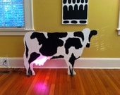 Fabulous wooden cow with pink neon udders