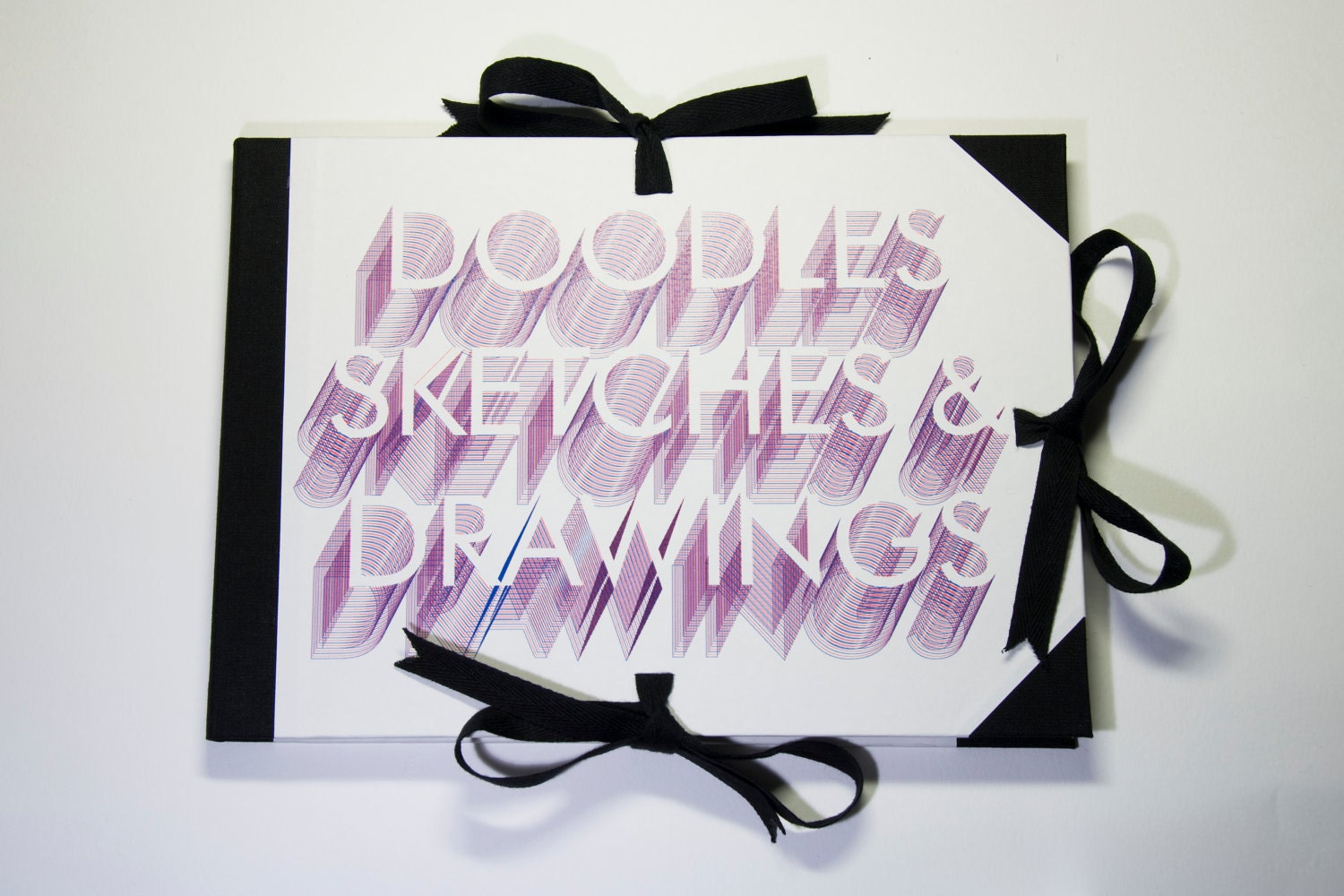 Drawing pad portfolio with typographic cover design