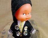 Tiny rubber doll with traditional spanish clothes. So cute little boy