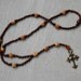 Wooden Rosary with yak bone skull beads and copper cross