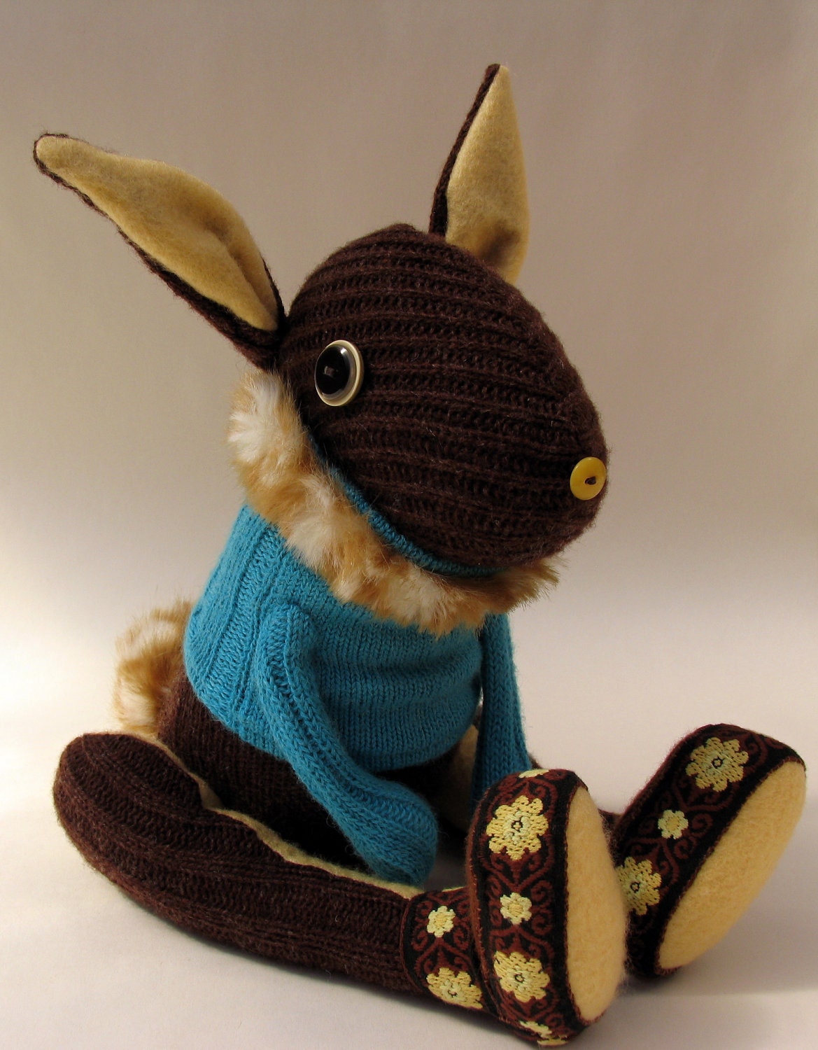 Brown Woollen Rabbit - Handmade plush sculpture - brown woollen body with flesh coloured felt ears - wearing turquoise woolly pullover.