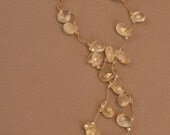 Faceted gold rutilated quartz briolette lariat with crystal