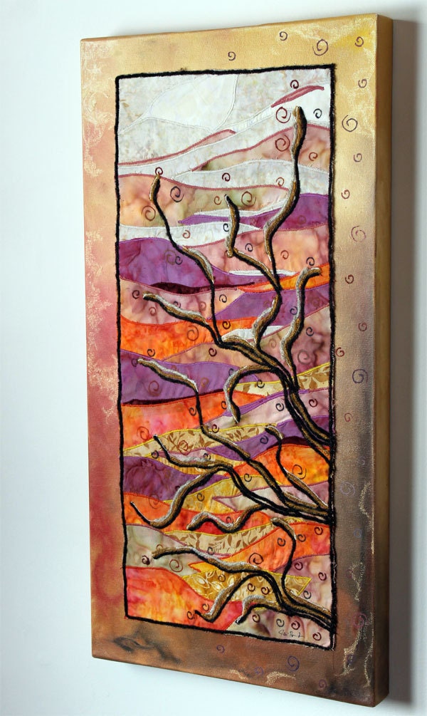 Tree branches with sunset and spirals: art quilt on painted canvas