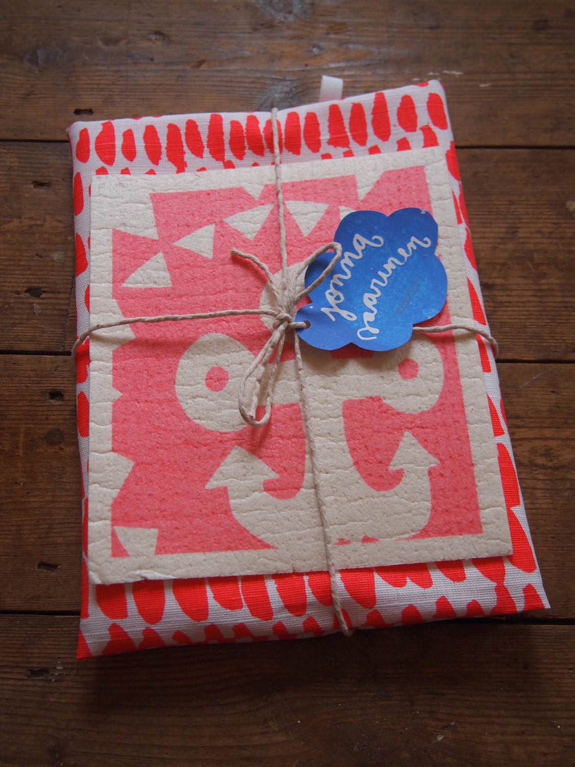 The 'Hundreds and Thousands' Tea towel and 'Anchor' Dishcloth bundle in pink and red