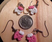 2 Out of my "tiny" head pink and white skullz
