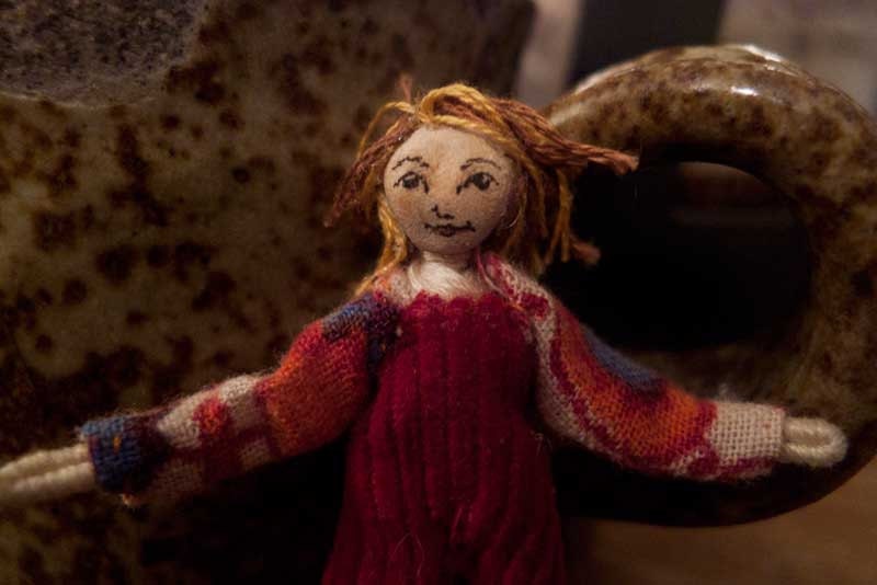 Pocket doll - girl in red overalls