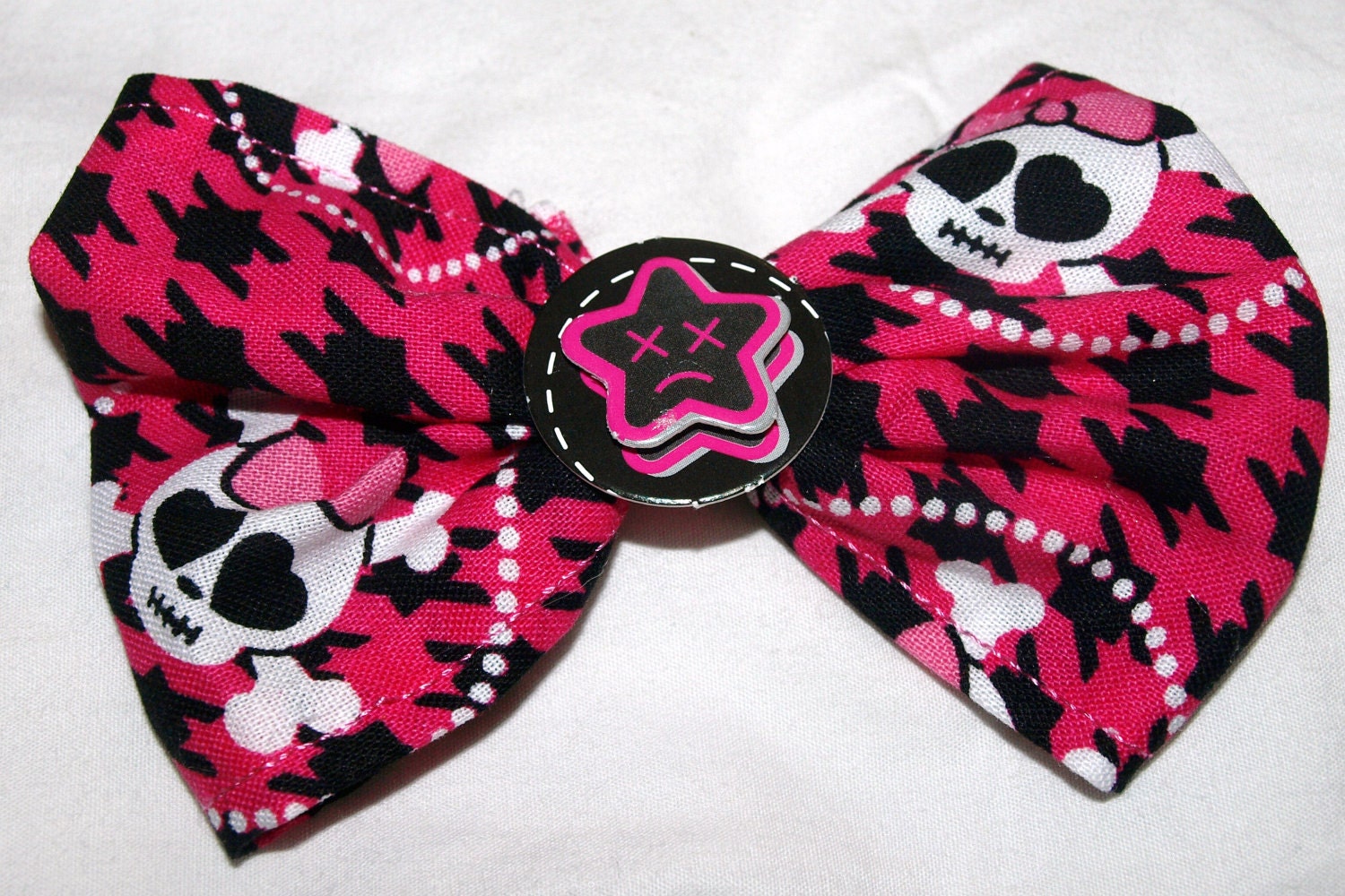 pink and black houndstooth and skull hair bow